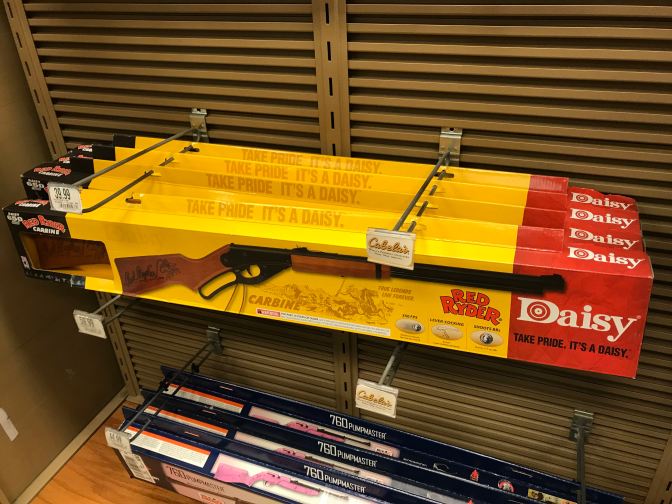 Rack of BB guns, with the Daisy Red Ryder carbine BB gun.