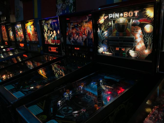 A row of pinball machines.