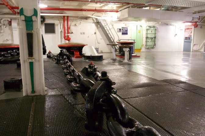 View of the anchor room, with one of the large anchor chains in the middle.