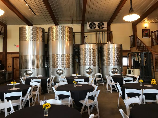 Stainless steel metal aging drums in tasting room.
