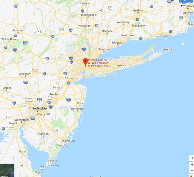 Map of New York and New Jersey, with a red pin in the location of the Intrepid Sea, Air, and Space Museum.
