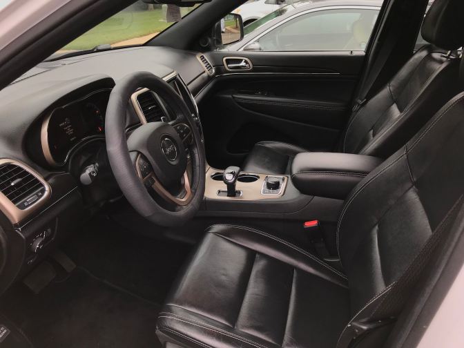 Clean interior of 2014 Jeep Grand Cherokee.
