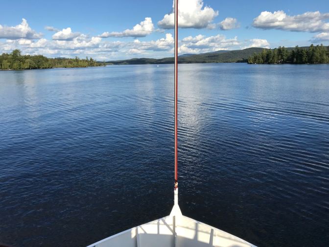 View of the bow of the WW Durant, with Raquette Lake beyond it.