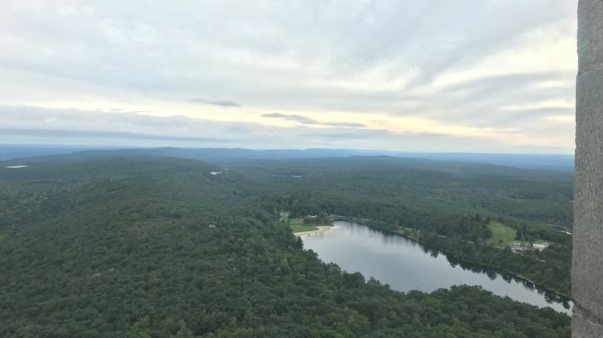 Vista from the top of the monument. A lake is in the foreground.