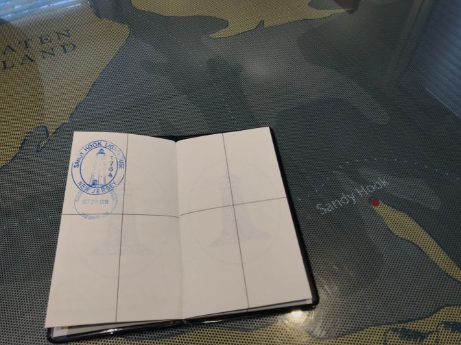 Lighthouse Passport Book on top of map of NJ Lighthouses.