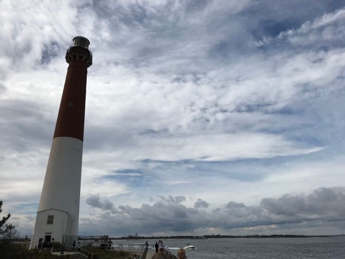 Exterior of Barnegat Light, with the bay in the background.