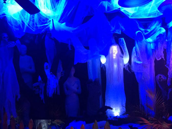 Ghoblins, ghosts, and witches in a hallway in the restaurant.