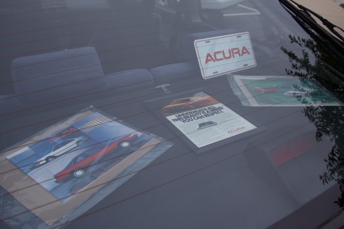 Display of promotional material on deck lid of Acura Integra trunk.