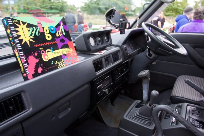 Dashboard of Mitsubishi Delica. The steering wheel is on the right of the dashboard.