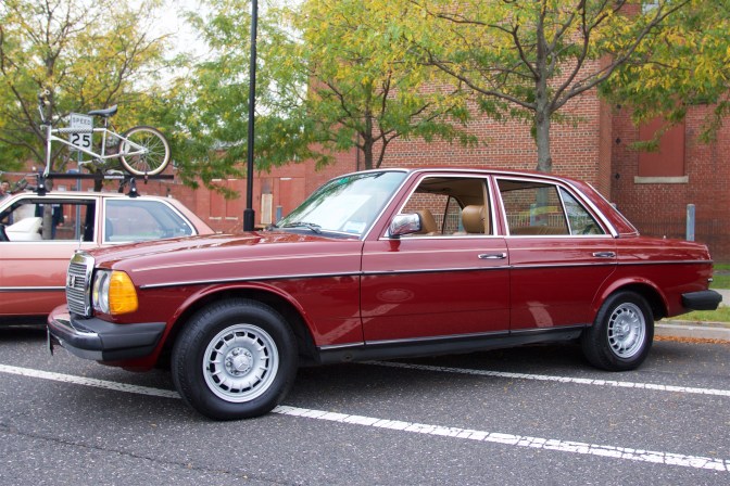 Red Mercedes-Benz sedan.