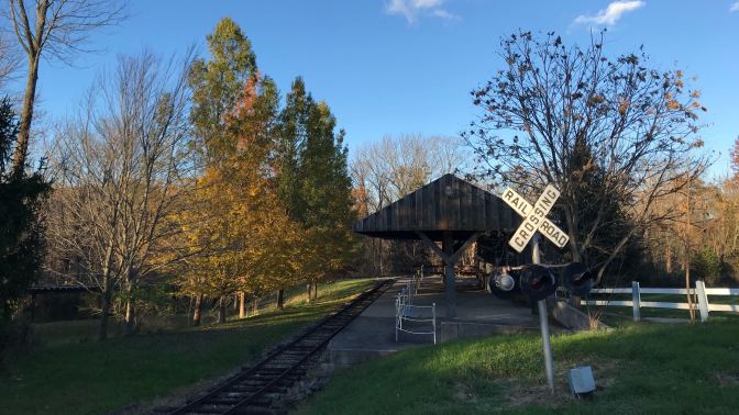 Small train station outside for child-scale train.