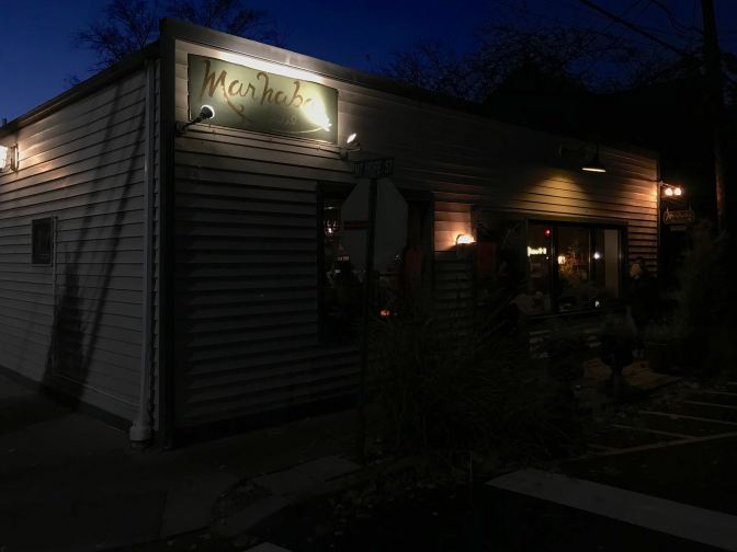 Exterior of Marhaba restaurant at dusk.