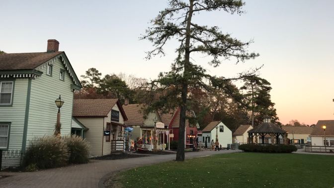 View of the green in Historic Smithville, with a gazebo in the middle and buildings surrounding it.