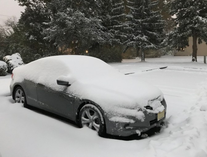 2012 Honda Accord coupe covered in snow.
