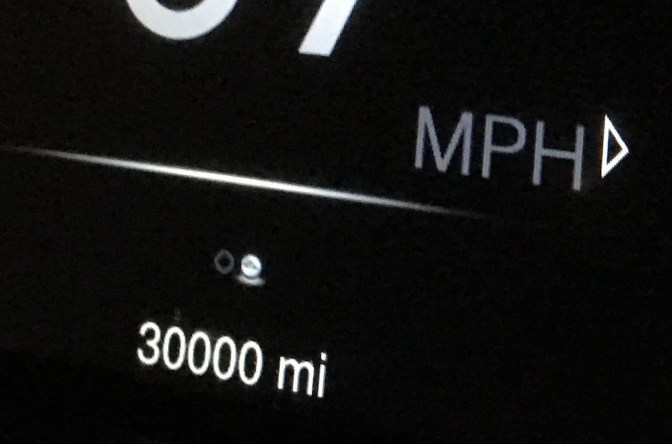 Car odometer reading 30,000 miles.