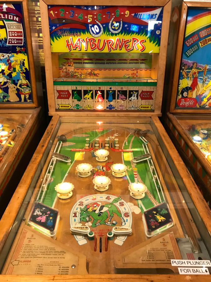 Hayburners by Williams pinball machine. The machine has a mechanical racetrack on the scoreboard.