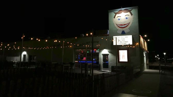 Wonderbar at night, with painting of Tillie on the side of the building.