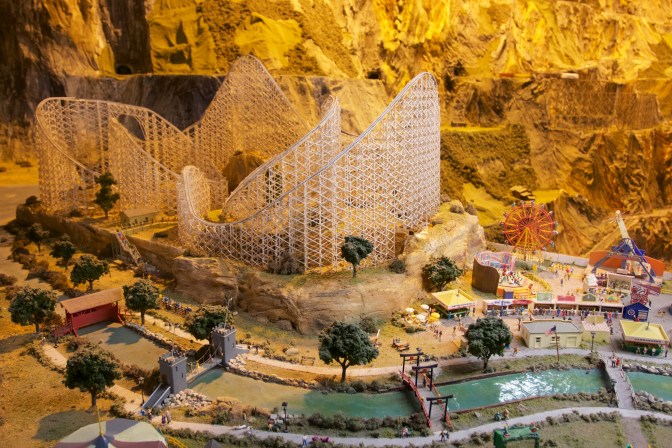 Amusement park model, including a roller coaster and a ferris wheel.