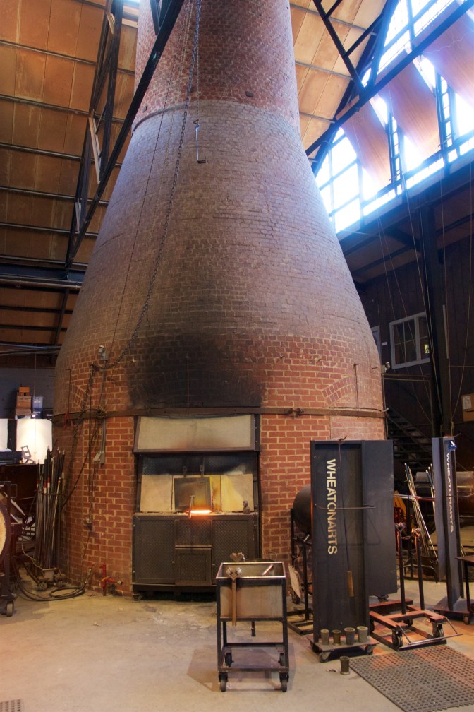 WheatonArts oven. Made from brick, one of the openings into the oven is visible.