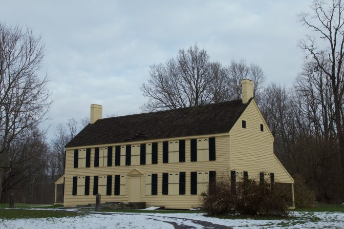 Exterior of the Schuyler House, a yellow two story clapboard house.