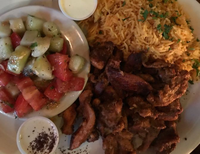 Chicken shawarma with pickled tomatoes and cucumbers and basmati rice.