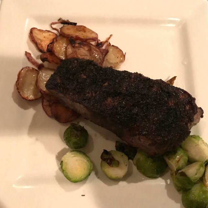 Plate with steak, potatoes, and brussel sprouts.
