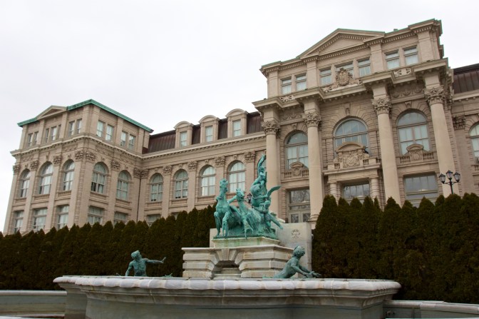 Exterior of LuEsther T. Mertz Library, with a fountain in the foreground.