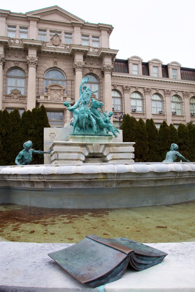 Lillian Goldman Fountain of Life. A bronze book is on the side of the fountain.