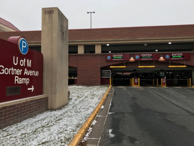 Entrance to parking garage. A sign on the left of the image says U of M Gortner Avenue Ramp.