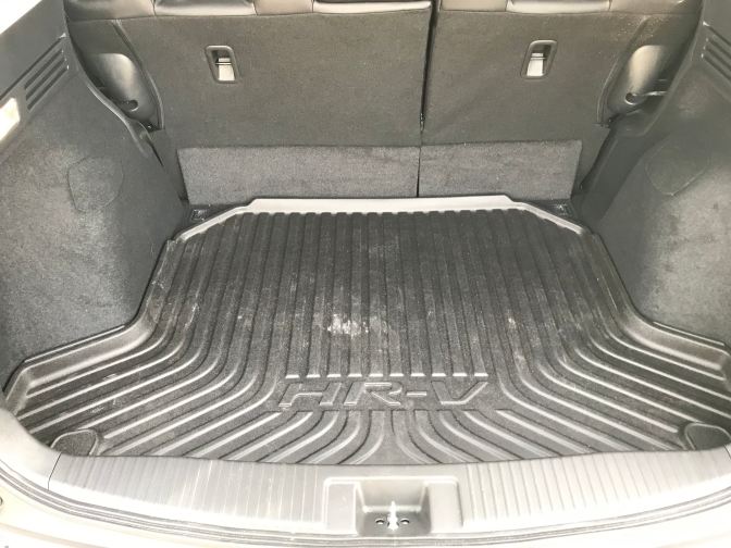 Trunk of HR-V. A rubber trunk mat says HR-V on it.