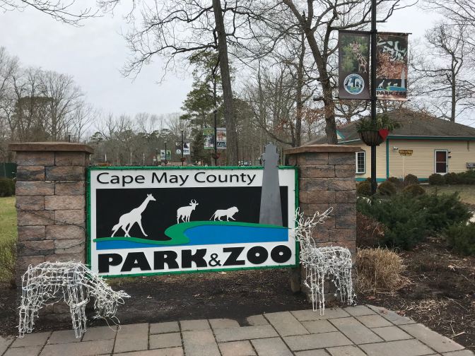 Entrance to Cape May Zoo. A sign says CAPE MAY COUNTY PARK & ZOO.