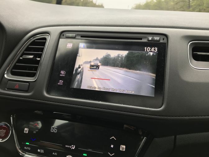 View of right rear view mirror on camera display in dashboard.