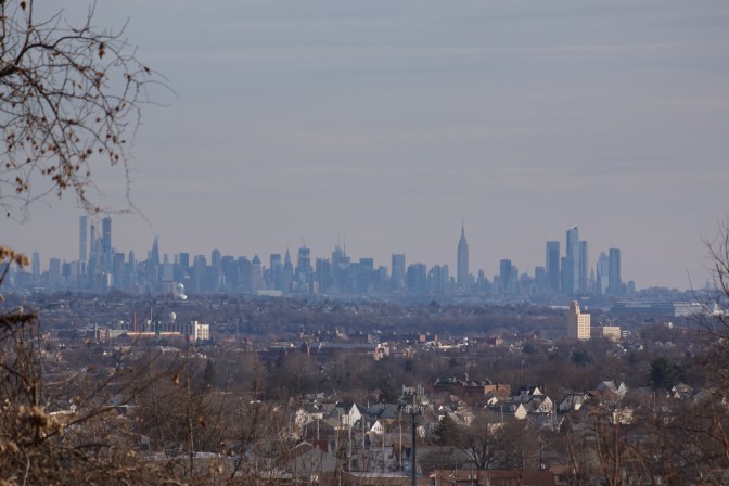 View of Paterson, NJ with skyline of Manhattan in the distance.