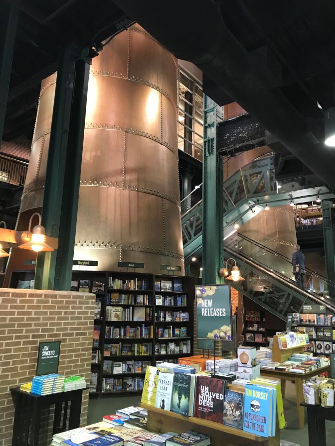 Interior of Barnes and Noble, with bookshelves in the foreground and boilers in the background.