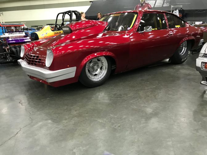Red Chevrolet Vega drag race car.