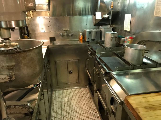 Ship's galley, with sink, stoves, and ranges.
