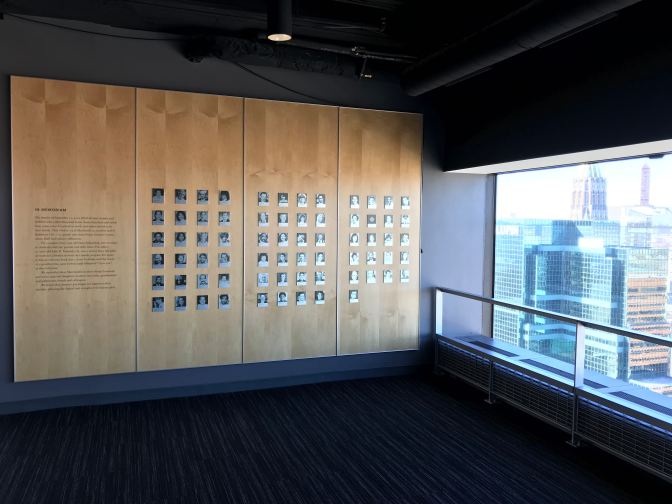 Wall of photographs, beside window facing north.