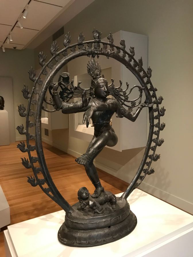 Statute of Shiva Nataraja, surrounded by a wire hoop with flames emanating from it.