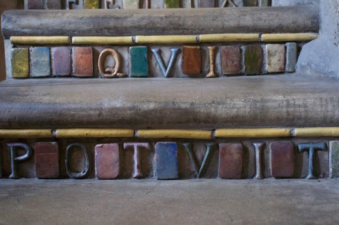 Tilework Latin inscription, on stairs.