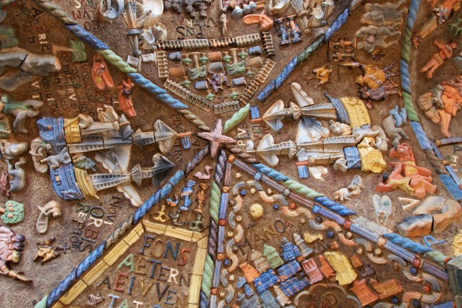Tilework mosaic of ships and exploration, on the ceiling.