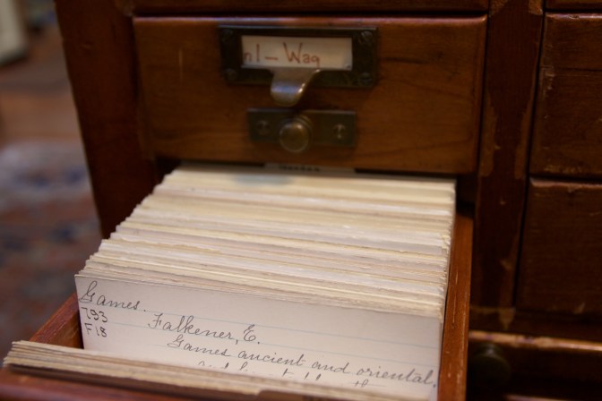 Card catalog drawer, open with a card for GAMES 793 F18 FALKENER E GAMES ANCIENT AND ORIENTAL is displayed.
