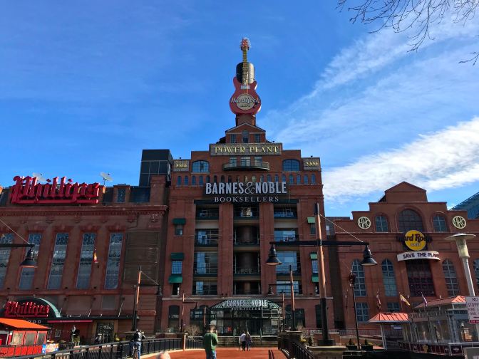 Exterior of Pratt Street Power Plant. The building says BARNES AND NOBLE BOOKSELLERS HARD ROCK CAFE PHILLIPS