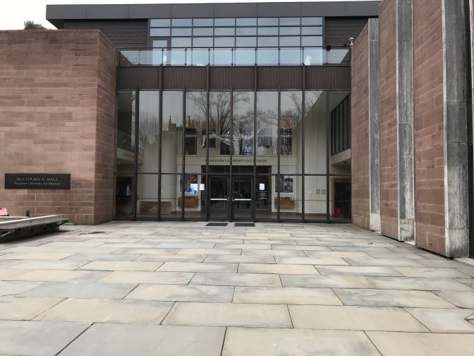 Exterior of McCormack Hall, with a glass and brick facade.