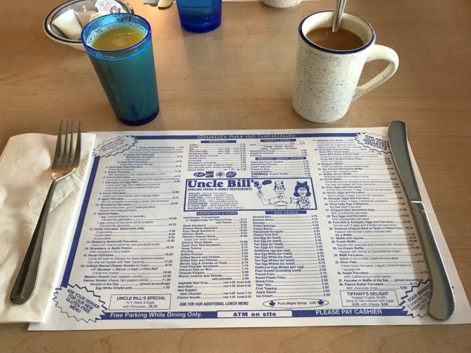 Coffee, orange juice, and placemat menu at Uncle Bill's.