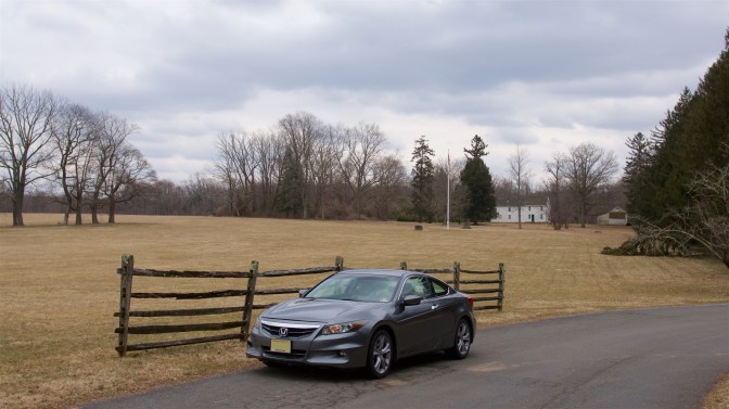2012 Honda Accord park in front of Princeton Battlefield. A large wooden fence is immediately behind it.