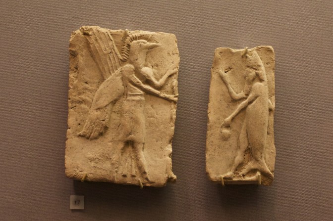 Tile of winged demon (left) and fish man (right).