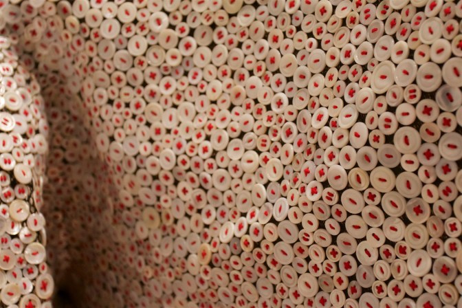 Fabric covered in buttons.