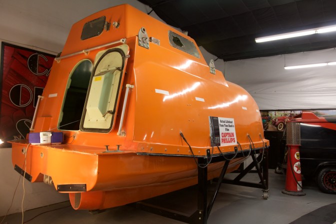 Exterior of orange lifeboat.