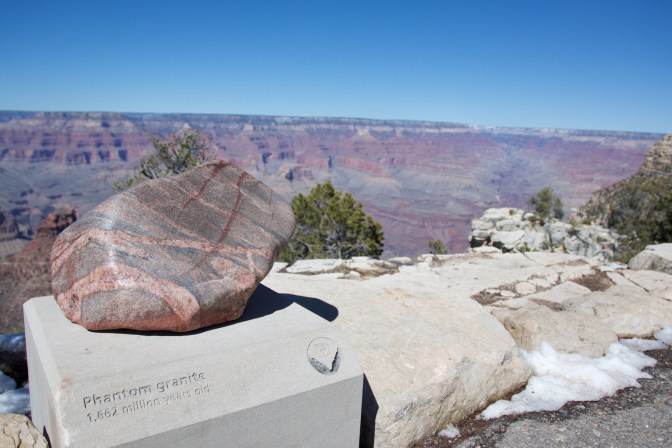 Piece of phantom granite on a pedestal. The canyon is in the background.
