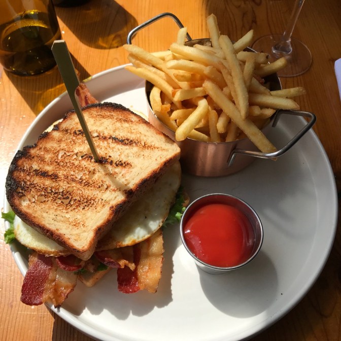 French fries on white plate with BLTE.